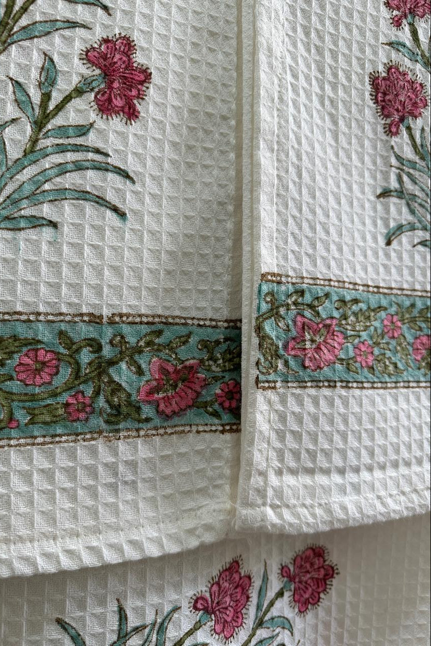 White fabric with floral embroidery and patterns