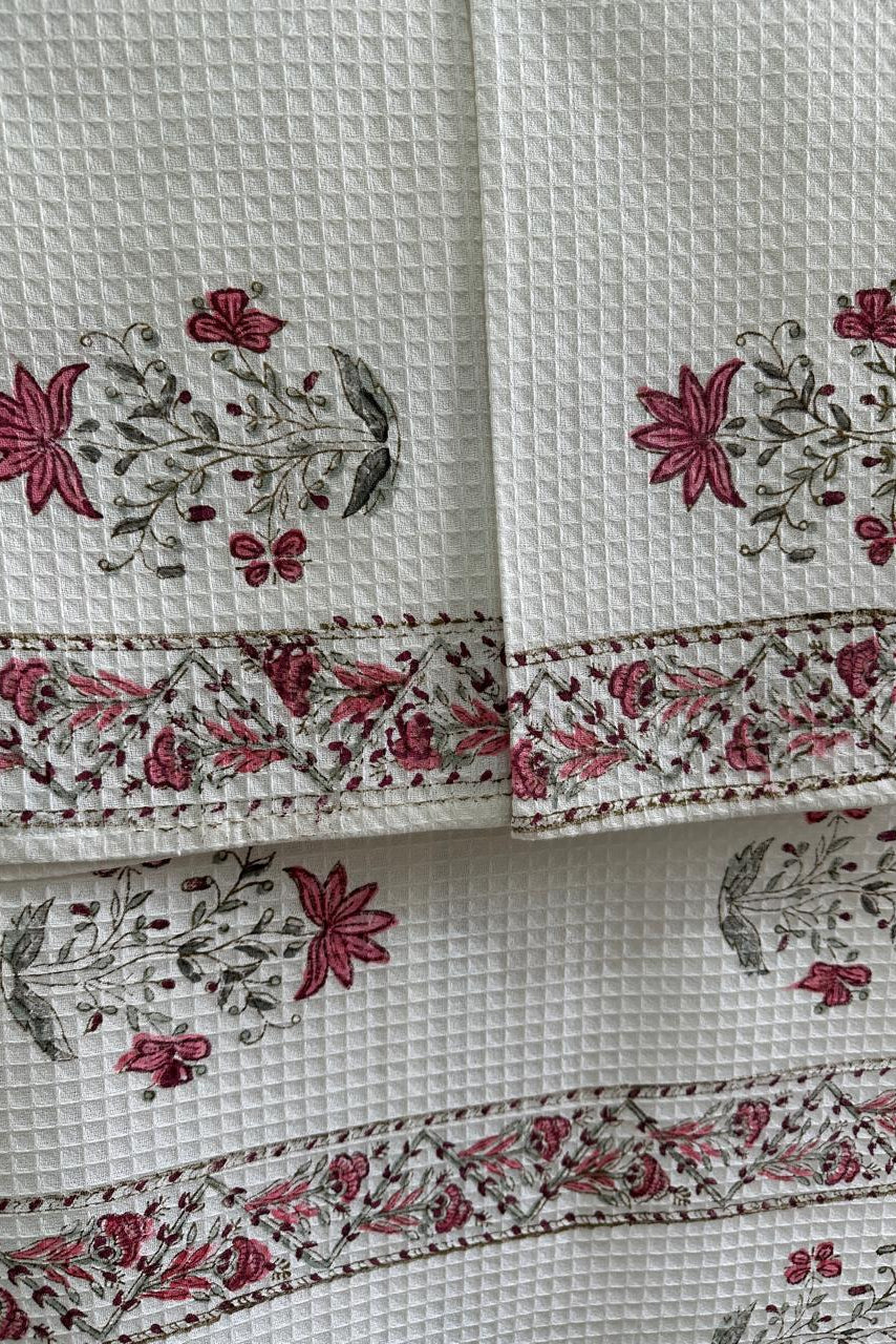 White fabric with floral patterned border